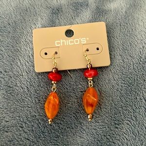 Orange color earrings.